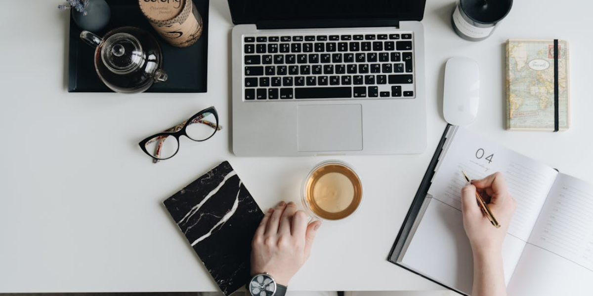 Professional on laptop choosing the best scheduling and payment app for their business